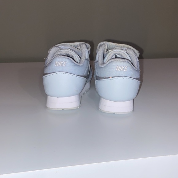 Nike. Light grey with shades of pink and white glow on the nike sign. Size 4 - Picture 3 of 4